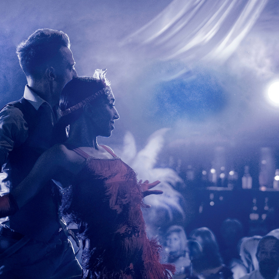 Two dancers embrace within smoke during private event in Edinburgh function room The Stables, in the grounds of Prestonfield House Hotel