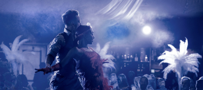 Two dancers embrace within smoke during private event in Edinburgh function room The Stables, in the grounds of Prestonfield House Hotel